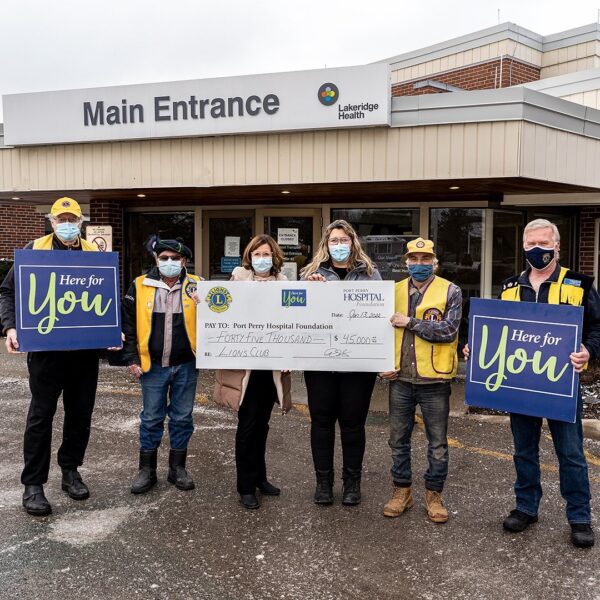Lions Club of Sunderland, Greenbank, Port Perry, and Blackstock Cartwright presenting a cheque to Port Perry Hospital Foundation CEO and a board member of the foundation outside Port Perry Hospital