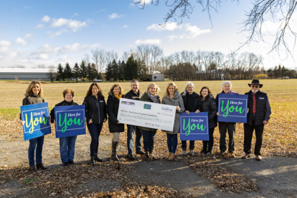 Puckrin and Latreille Real Estate Team cheque presentation for the Here for You campaign