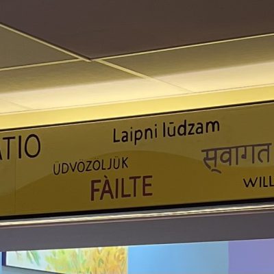 Welcome sign in the many languages of our Durham Community