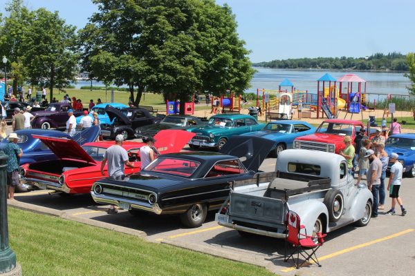 Classic cars with spectators lakeside in Port Perry