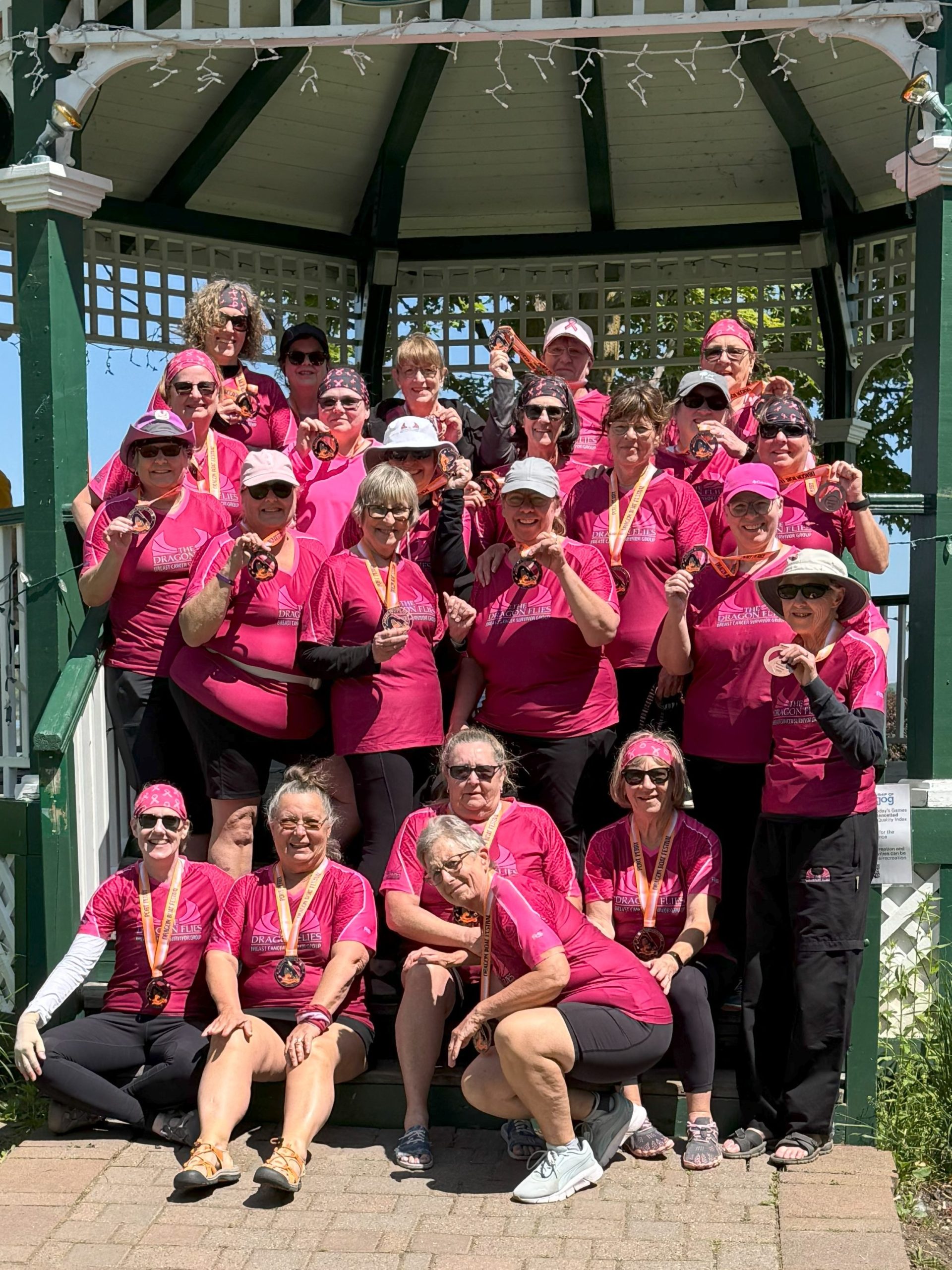 Dragon Flies team group photo by the gazebo.